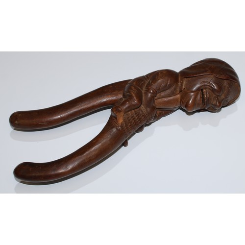 5078 - A Black Forest novelty lever-action nut cracker, carved as a gnome, full-length he sits astride, gri... 