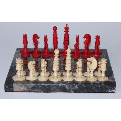 5006 - A 19th century bone Barleycorn pattern chess set, red stained opposition, the Kings 6cm high; an ony... 