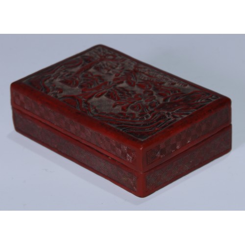 5102 - A Chinese cinnabar lacquer rectangular box and cover, carved with a sage and an elder in a monumenta... 