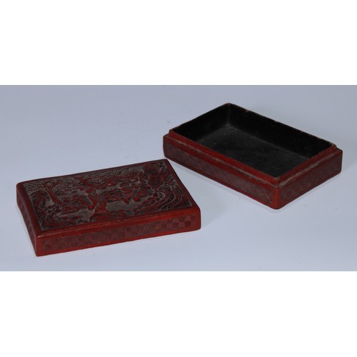 5102 - A Chinese cinnabar lacquer rectangular box and cover, carved with a sage and an elder in a monumenta... 