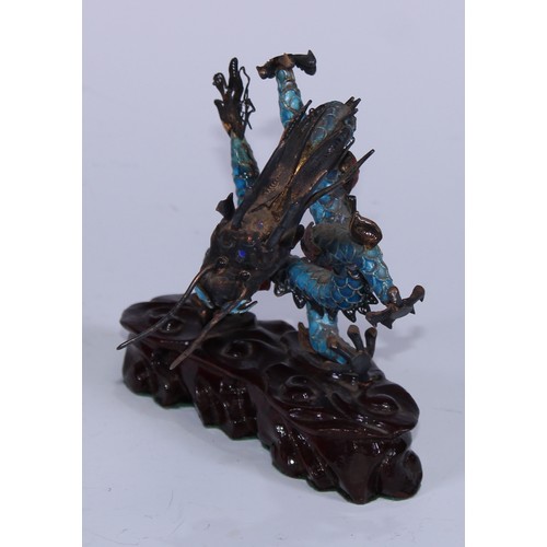 5127 - A Chinese silver coloured metal and enamel model, of a ferocious dragon, carved hardwood base, 12cm ... 