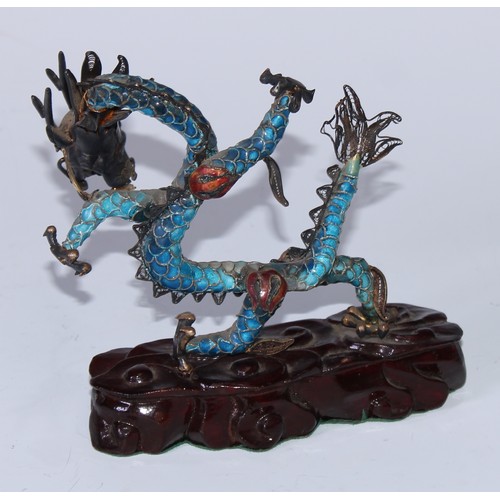 5127 - A Chinese silver coloured metal and enamel model, of a ferocious dragon, carved hardwood base, 12cm ... 