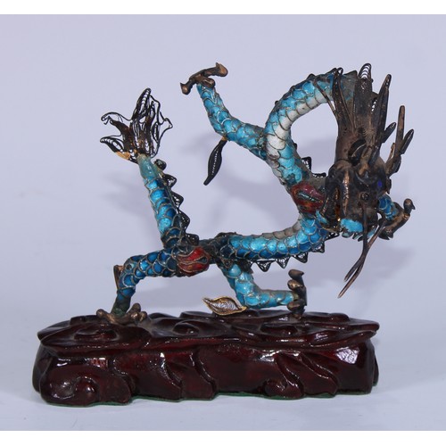 5127 - A Chinese silver coloured metal and enamel model, of a ferocious dragon, carved hardwood base, 12cm ... 