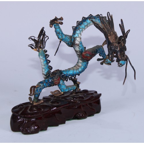 5127 - A Chinese silver coloured metal and enamel model, of a ferocious dragon, carved hardwood base, 12cm ... 