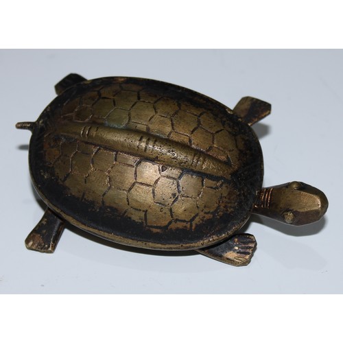 5099 - A Chinese bronze lock, cast as a turtle, 8cm long; a  zoomorphic belt hook, inlaid with roundels and... 