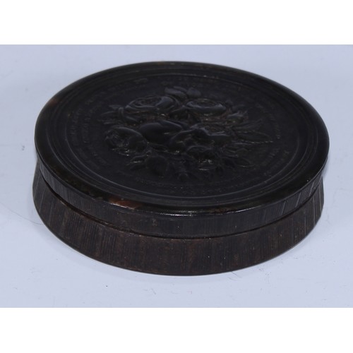 5062 - A 19th century pressed horn circular snuff box, by Wilson of Sheffield, the push-fitting cover in re... 