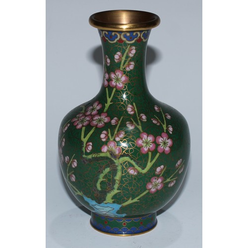 5107 - A Chinese cloisonne zun shaped vase, decorated in polychrome with a bird and blossoming prunus, on a... 