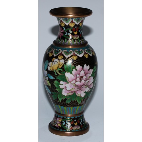 5107 - A Chinese cloisonne zun shaped vase, decorated in polychrome with a bird and blossoming prunus, on a... 