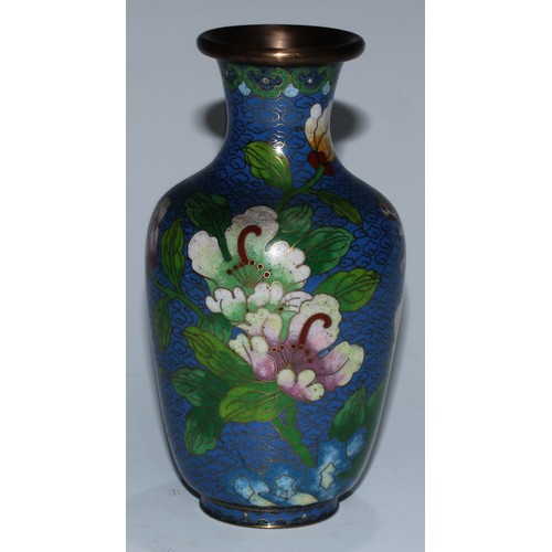 5107 - A Chinese cloisonne zun shaped vase, decorated in polychrome with a bird and blossoming prunus, on a... 