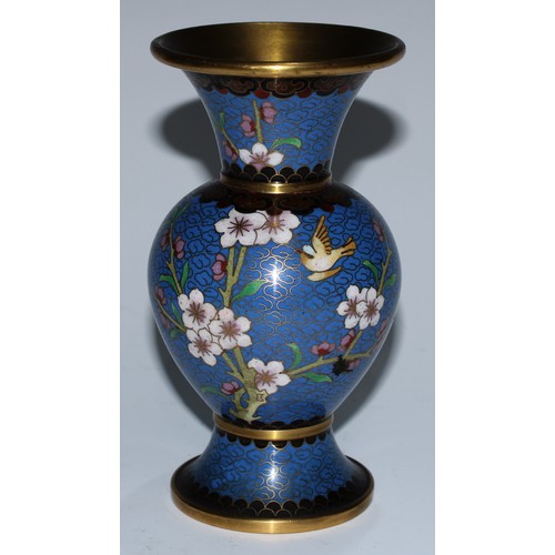 5107 - A Chinese cloisonne zun shaped vase, decorated in polychrome with a bird and blossoming prunus, on a... 