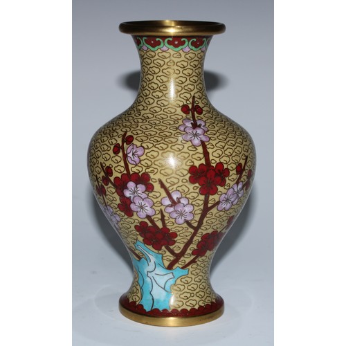 5107 - A Chinese cloisonne zun shaped vase, decorated in polychrome with a bird and blossoming prunus, on a... 