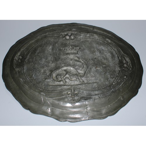 5149 - A French pewter armorial shaped oval platter, the field centred by a crowned salamander, 43.5cm wide... 