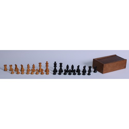 5083 - A boxwood and ebony Staunton pattern weighted chess set, the Kings 7.5cm, oak box