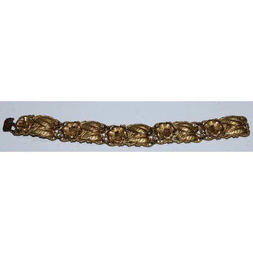 5066 - A 19th century cowrie shell purse, 6cm wide; another; a gilt metal bracelet (3)