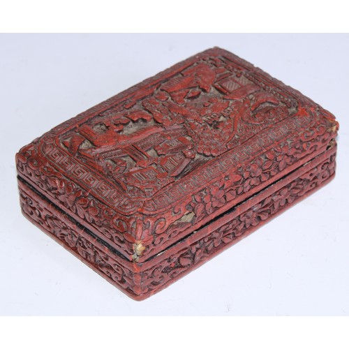 5103 - A Chinese cinnabar lacquer rounded rectangular box and cover, in relief with figures in a pagoda gar... 