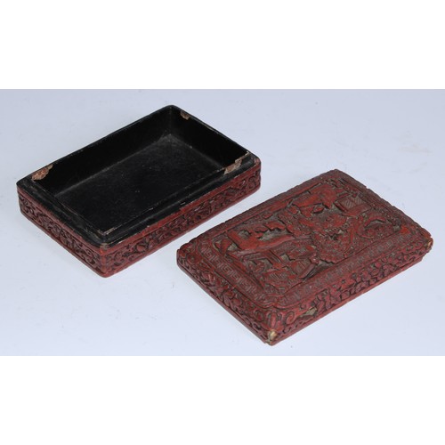 5103 - A Chinese cinnabar lacquer rounded rectangular box and cover, in relief with figures in a pagoda gar... 