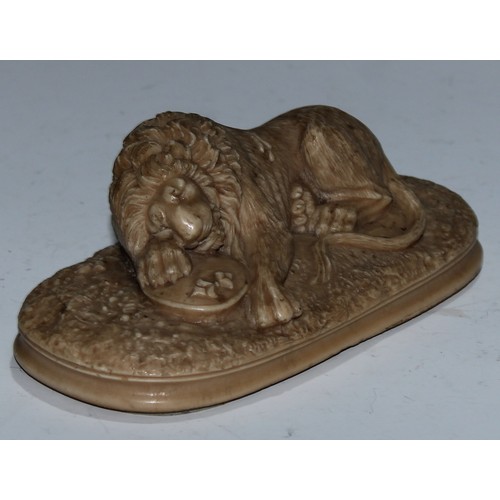 5162 - A Grand Tour lava or sulphur library model, carved as the Lion of Lucerne, oval base, 15.5cm wide