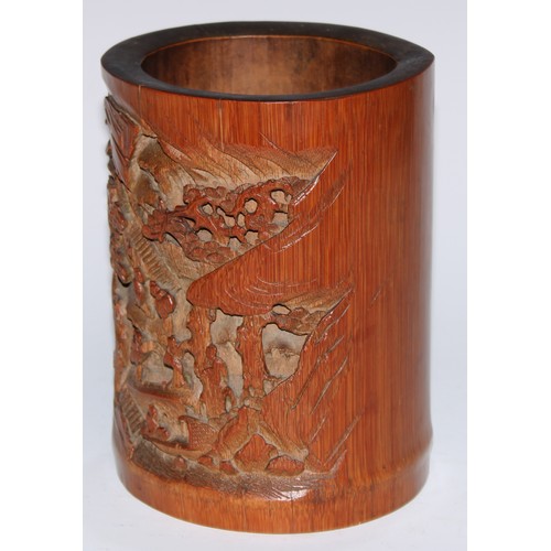 5095 - A Chinese bamboo bitong brush pot, well-carved in relief with figures in a monumental landscape, 18c... 