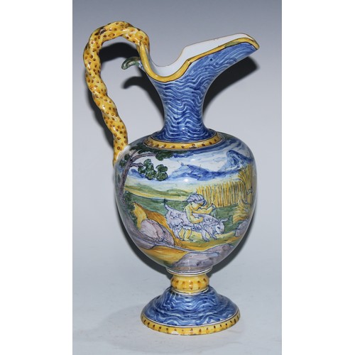 5222A - A South European maiolica ewer, painted in the Istoriato manner with a suggestive seen of nymph, sat... 