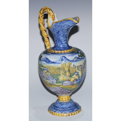 5222A - A South European maiolica ewer, painted in the Istoriato manner with a suggestive seen of nymph, sat... 