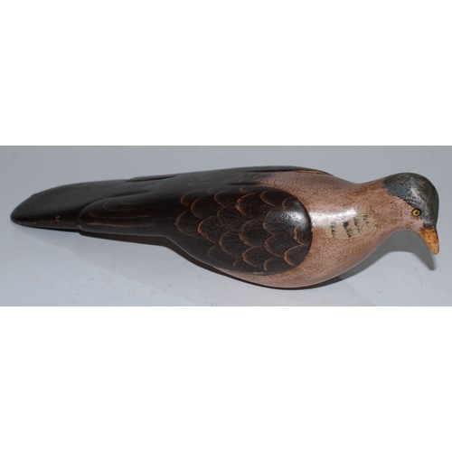 5091 - A carved softwood decoy, as a water bird, 25cm long; another (2)