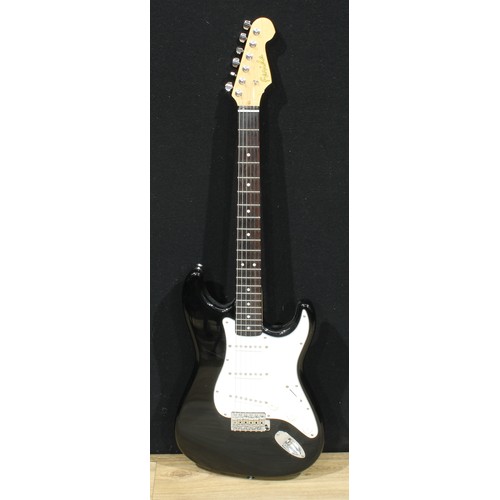 5667 - A Farida electric guitar, black finish, white scratchboard, 98cm long, cased