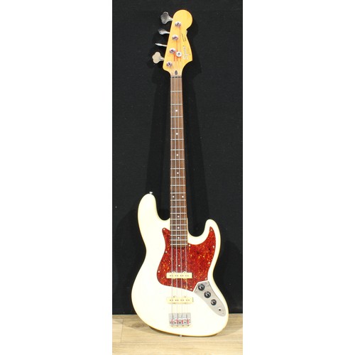 5671 - A Fender Squier Jazz Bass guitar, made in Korea, numbered S1006951, 117cm long