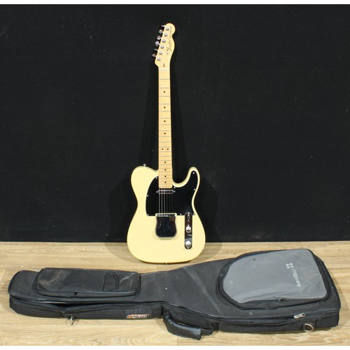 5673 - A Fender Telecaster guitar, made in the USA, numbered US15013243, ivorine-coloured finish, 98cm long... 