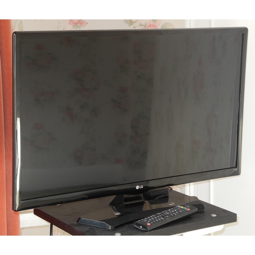 141 - A LG television and remote control