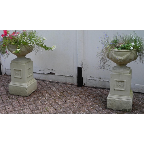 164 - Garden Statuary - pair of  reconstituted garden urn on stand