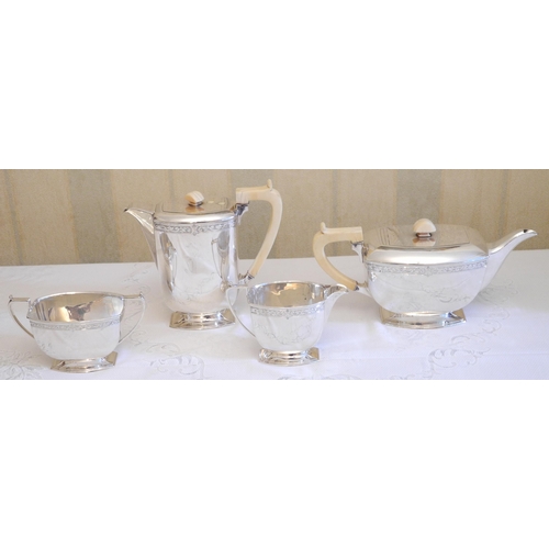 170 - A silver four piece tea service, of angular boat form, engraved with a band of scrolling foliage,  F... 