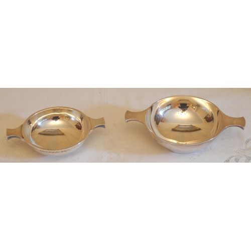 176 - An Elizabeth II silver wine taster, lug handles, 15cm wide,  David Shaw Silverware Ltd, Birmingham 1... 