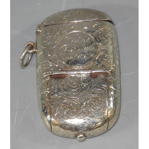 178 - A Victorian silver rounded rectangular combination vesta/sovereign case, engraved and chased with fo... 