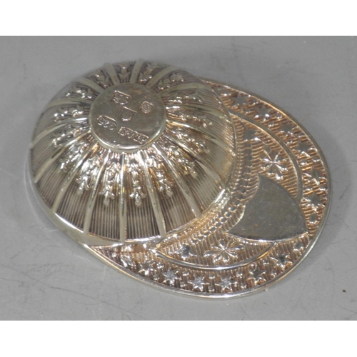 181 - An Elizabeth II  silver novelty caddy spoon, as a jockey's cap, embossed with stiff leaves, James Di... 