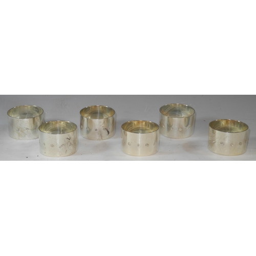 305 - A set of six silver cylindrical napkin rings, quite plain, oversized hallmarks, James Dixon & Sons, ... 