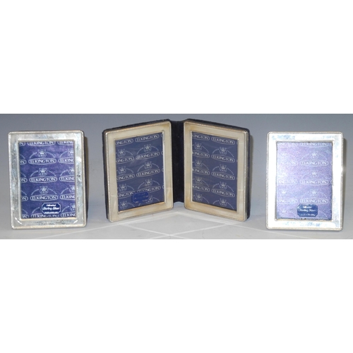 313 - A set of three silver photograph frames, the pair of single image rectangular beaded frames with eas... 