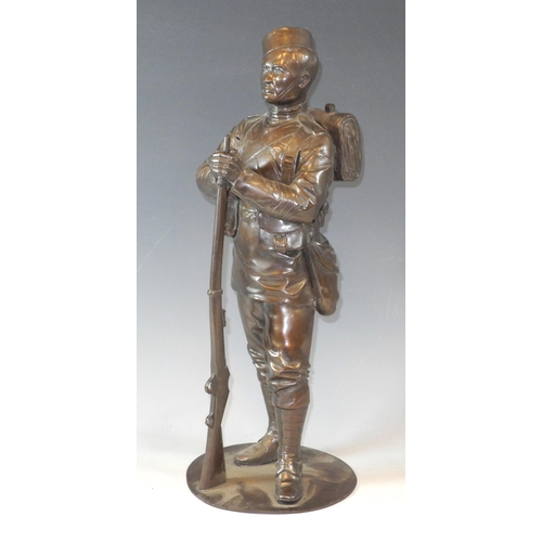 318 - Military  Interest - English School, early 20th century, a 'bronzed' figure of a Gurka soldier, stan... 