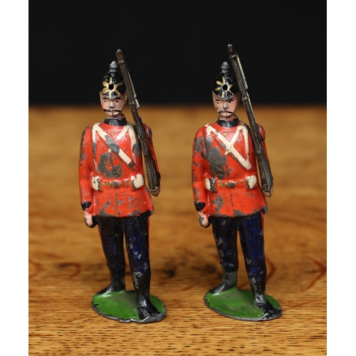 122 - W Britain (Britains) The Royal West Surrey Regiment, comprising two Infantry figures, each marching ... 
