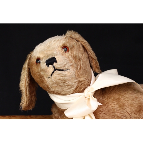 132 - A 1930’s brown and cream mohair Dog, straw filled head with brown and black glass eyes, black vertic... 