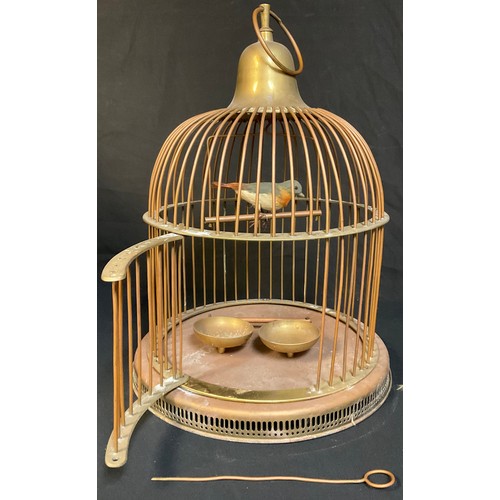 157 - A brass and copper bird cage, 44cm high