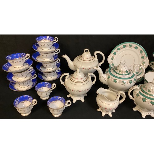 159 - A late 19th century teapot, sucrier and cream jug, decorated with stylised flowers, c.1870;  another... 