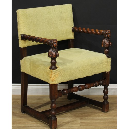 113 - A Jacobean Revival oak open armchair, spirally-turned arms, the arm posts carved as female herms, tu... 