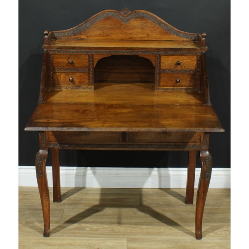 114 - An Anglo-Indian design bureau, three-quarter gallery above a fall front enclosing four small drawers... 
