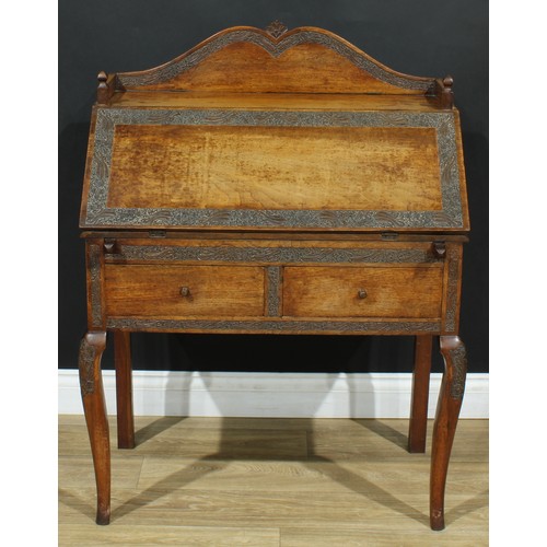 114 - An Anglo-Indian design bureau, three-quarter gallery above a fall front enclosing four small drawers... 