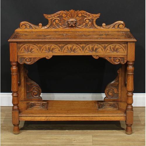 116 - A carved oak side table or hall table, later converted from a walking stick or umbrella stand, 92cm ... 