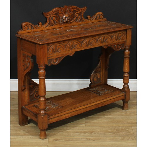116 - A carved oak side table or hall table, later converted from a walking stick or umbrella stand, 92cm ... 