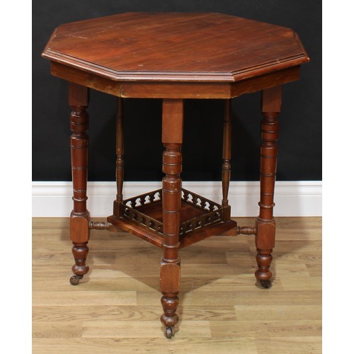 648 - An early 20th century mahogany octagonal centre table; a retro mid 20th century bentwood bar chair (... 