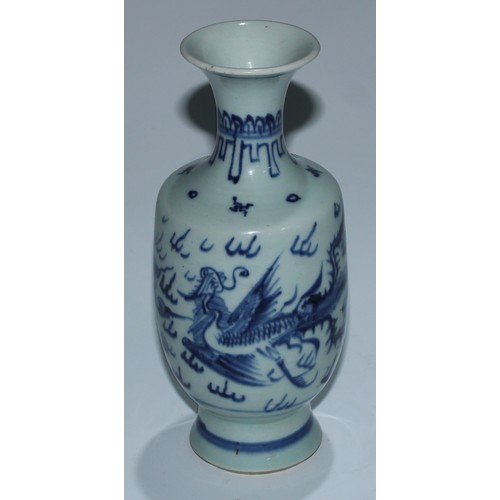 11 - A Japanese porcelain inverted baluster vase, well-painted with a profusions of chrysanthemums and fl... 