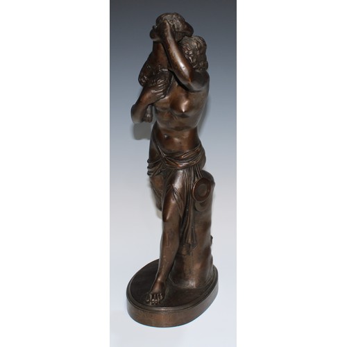 24 - A 19th century brown patinated library sculpture, Baccante and Infant Faun, oval base, 45.5cm high, ... 