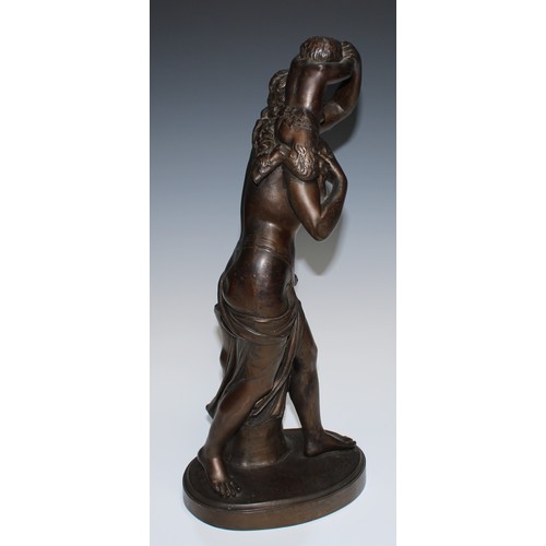 24 - A 19th century brown patinated library sculpture, Baccante and Infant Faun, oval base, 45.5cm high, ... 